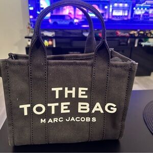 Marc Jacobs Black Tote Bag with Sturdy Fabric and Prominent Text